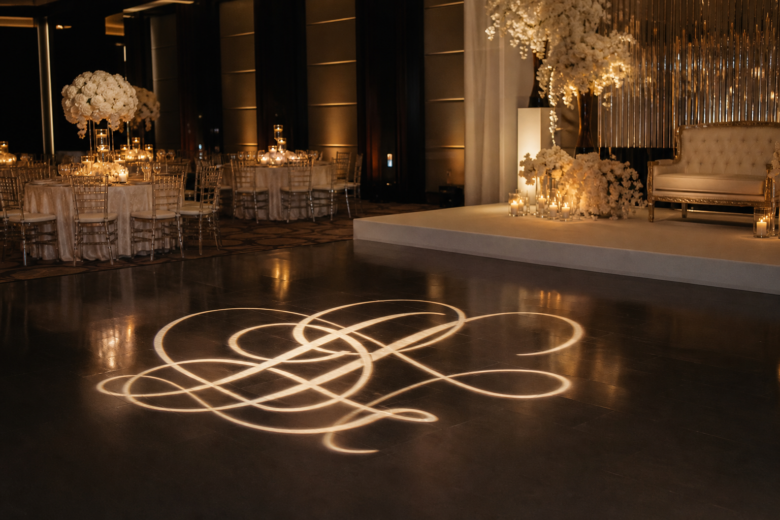 Custom monogram projection across an elegant wedding dance floor